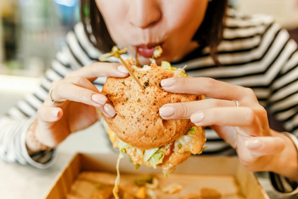 Woman eating a hamburger