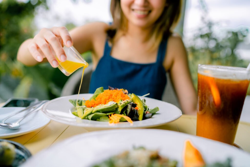 Women eating a healthy salad at a local Rancho Cucamonga wellness restaurant